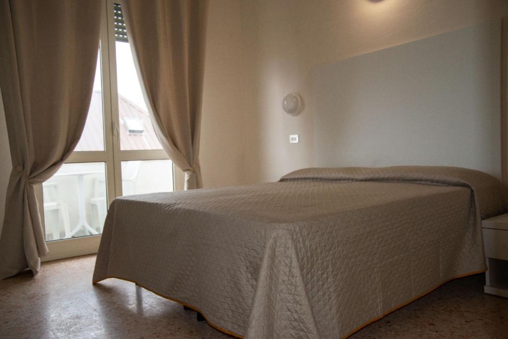 Postel nebo postele na pokoji v ubytování LC Hotel by Gale