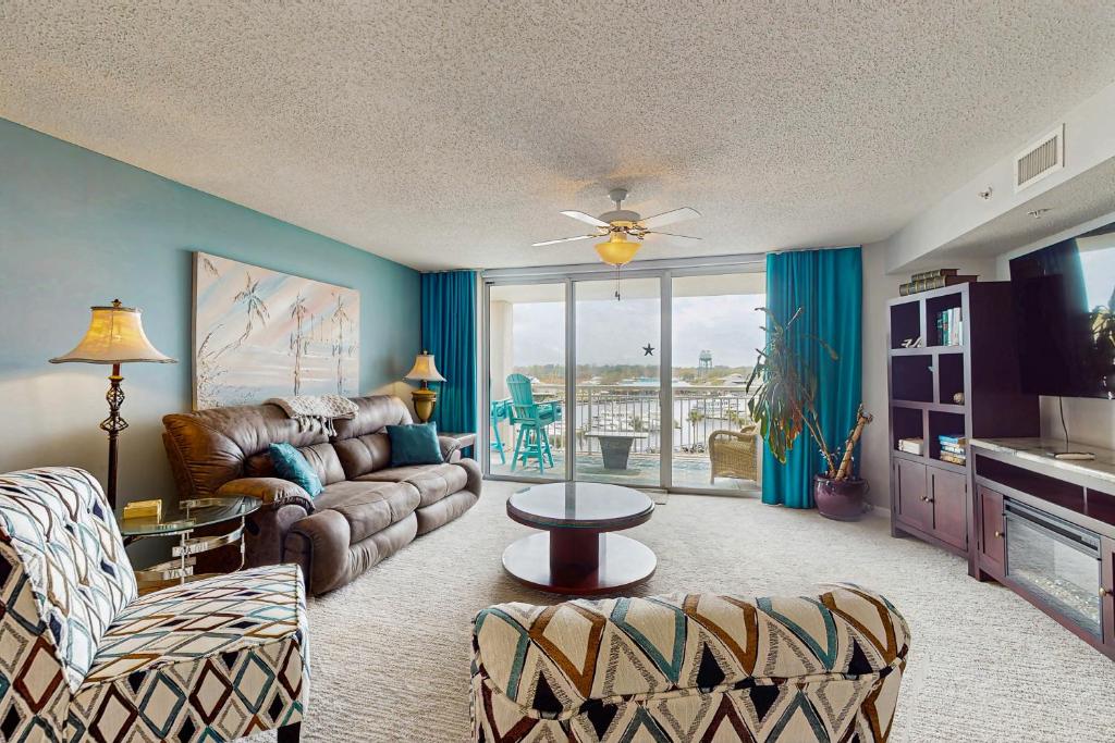 a living room with a couch and a table at Yacht Club Villas 1-501 in Myrtle Beach