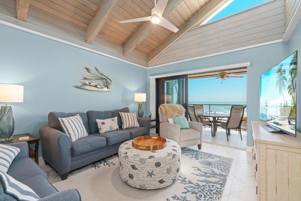 a living room with a couch and a table at Pine Cove 403C in Sanibel