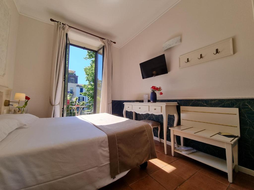 Postel nebo postele na pokoji v ubytování Hotel Charly