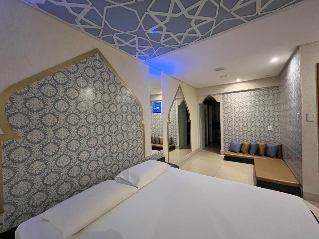 En eller flere senge i et værelse på Drops Motel Goiânia