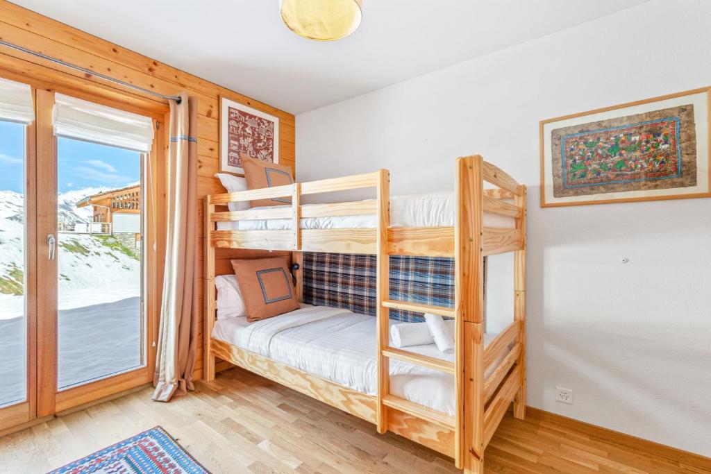 Postel nebo postele na pokoji v ubytování Chalet Magrappe, accès direct à la piste des Mayens de Veysonnaz