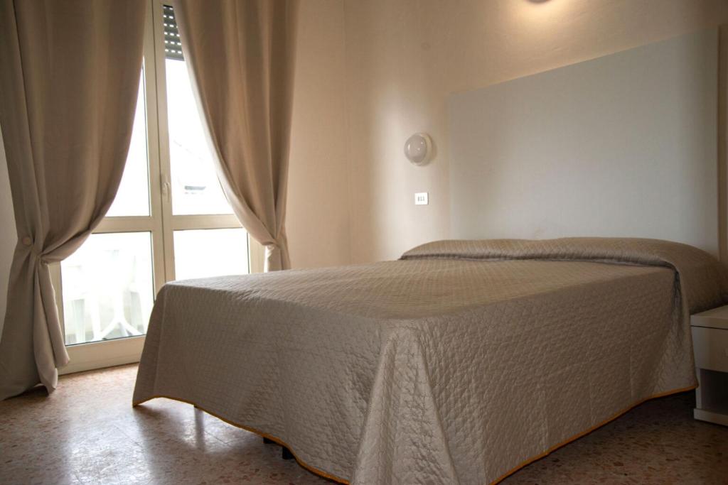Postel nebo postele na pokoji v ubytování LC Hotel by Gale