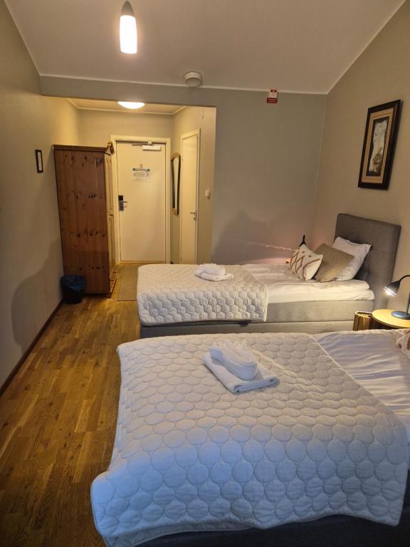 Postel nebo postele na pokoji v ubytování Hotel Fritza