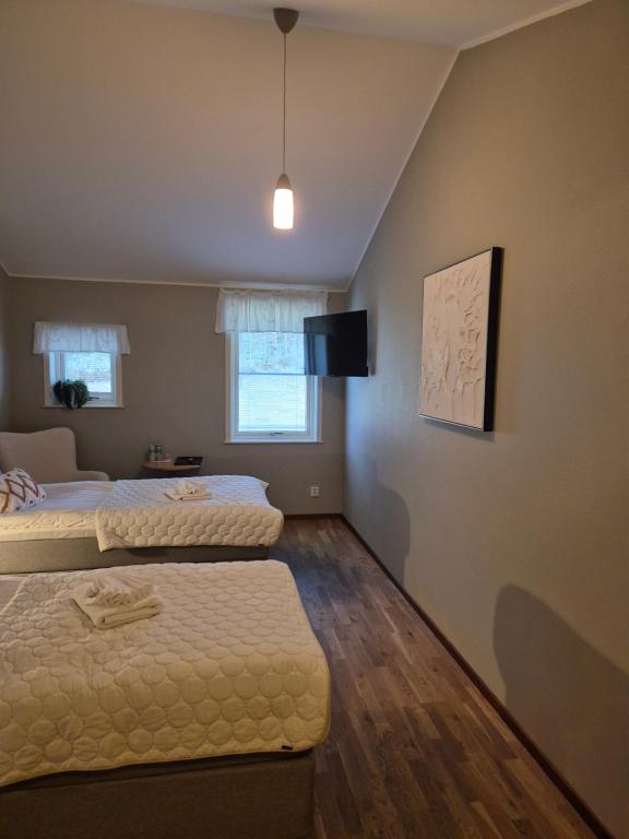 Postel nebo postele na pokoji v ubytování Hotel Fritza