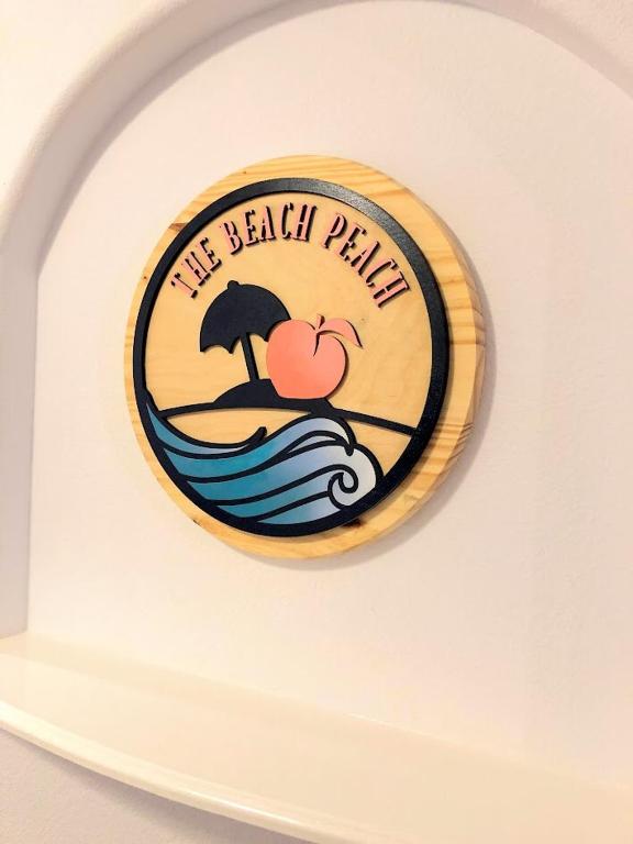 Majutusasutuses The Beach Peach olev sertifikaat, autasu, silt või muu dokument