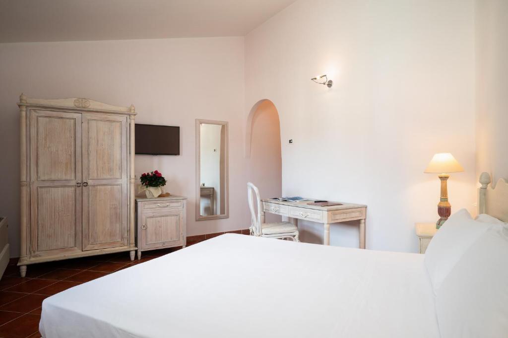 Postel nebo postele na pokoji v ubytování Hotel Monti Di Mola