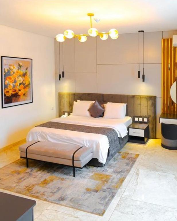 Postel nebo postele na pokoji v ubytování Vertus Hotel and Suites