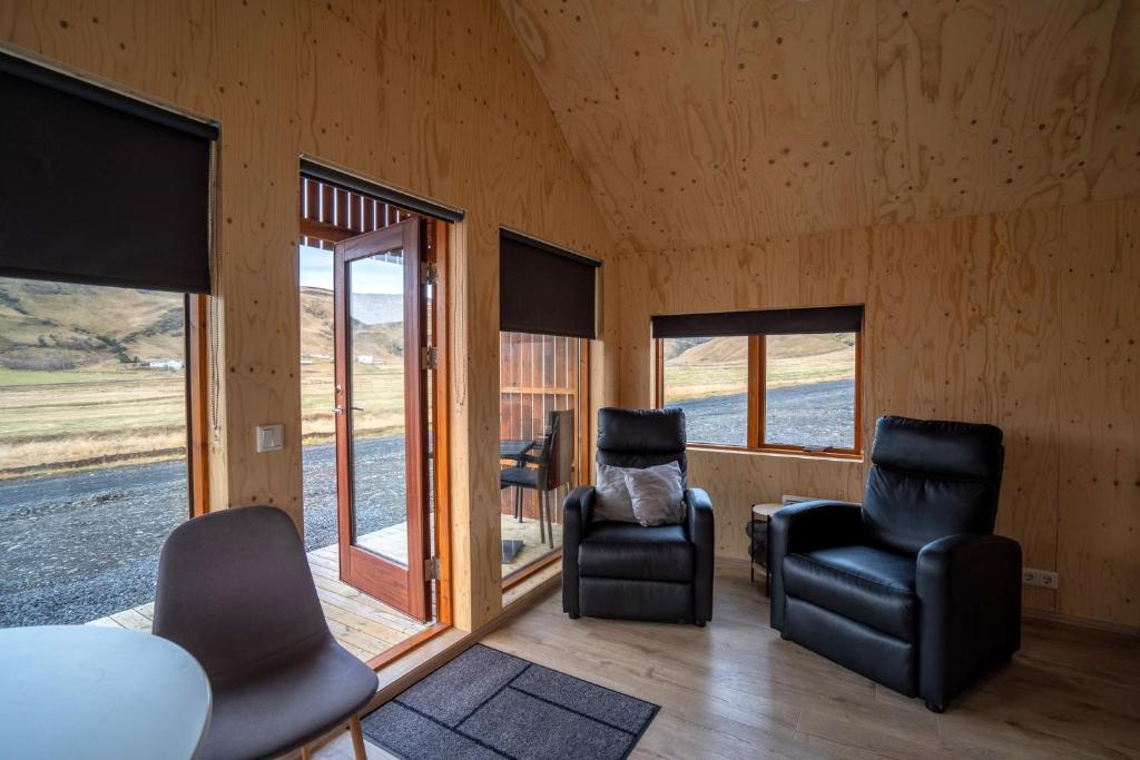Predel za sedenje v nastanitvi Paradise Cottages