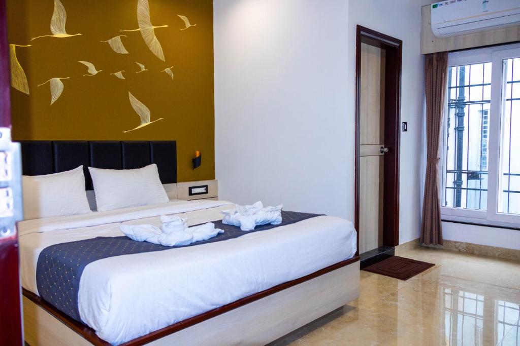 Postel nebo postele na pokoji v ubytování The Executive Inn
