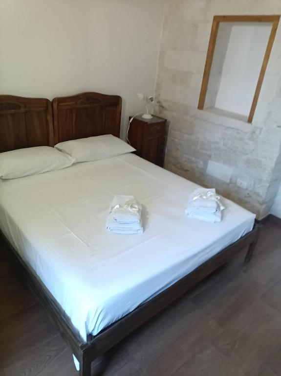 Posteľ alebo postele v izbe v ubytovaní Trulli in Martina Franca residence