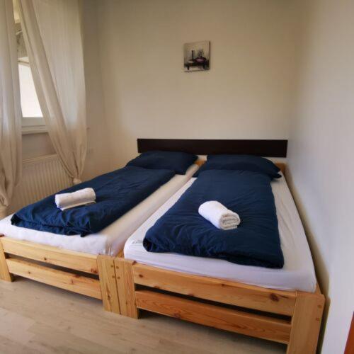 Postel nebo postele na pokoji v ubytování 4Season Apartman