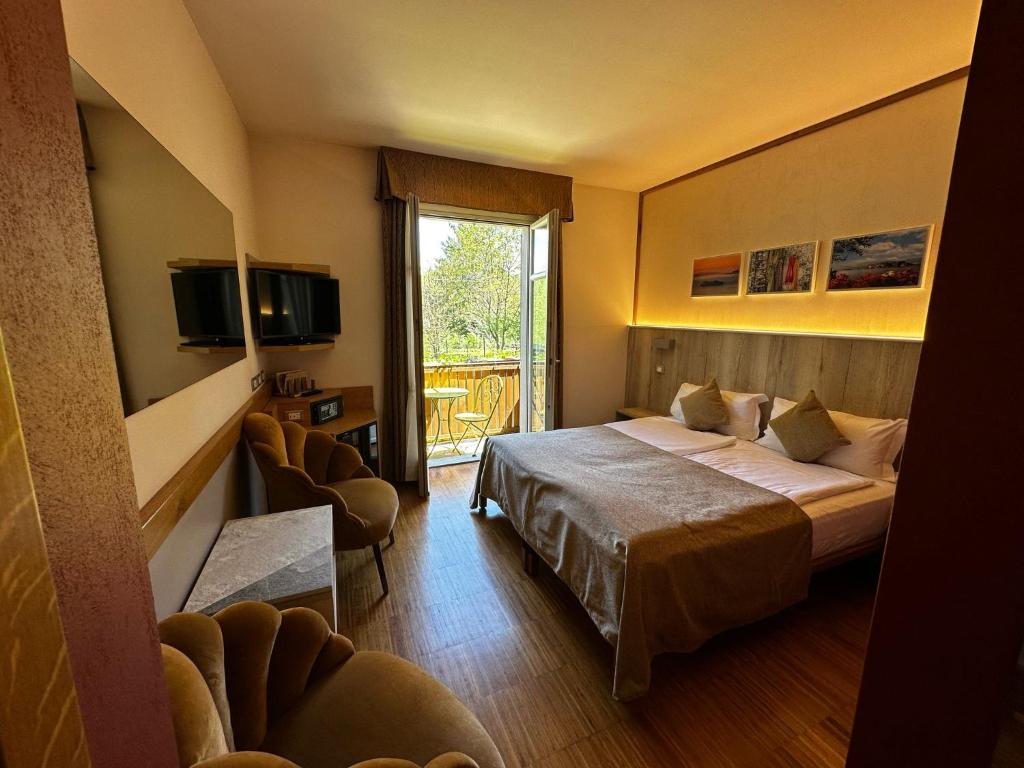 Postel nebo postele na pokoji v ubytování Hotel Cortese