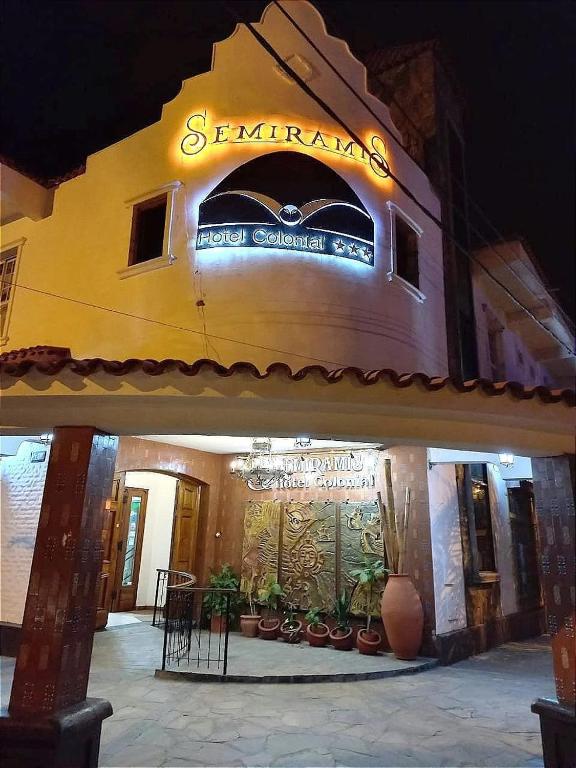 a building with a sign on the front of it at Hotel Semiramis Colonial in Termas de Río Hondo
