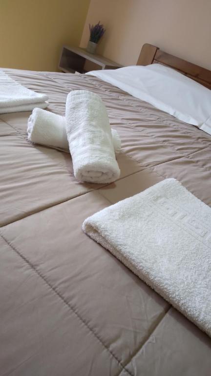 Postel nebo postele na pokoji v ubytování HOLIDAYS APARTMENT ΜΕΣΣΗΝΗ