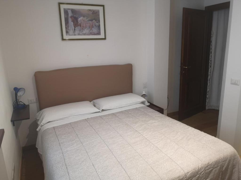 Postel nebo postele na pokoji v ubytování Il Gelsomino