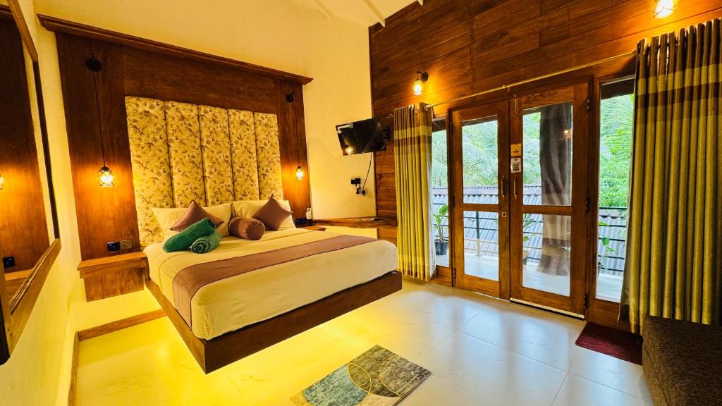Postel nebo postele na pokoji v ubytování Palmyra Nature Resort Sigiriya