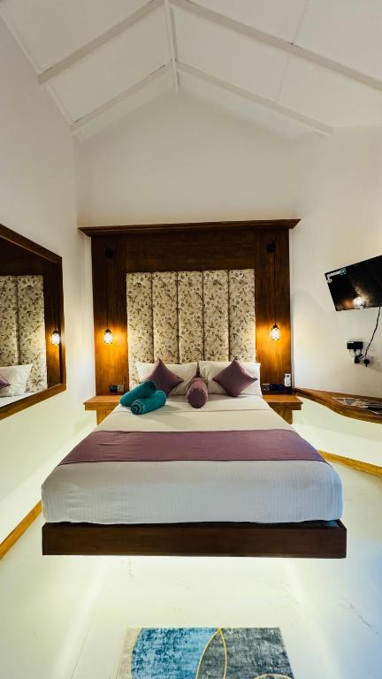 Postel nebo postele na pokoji v ubytování Palmyra Nature Resort Sigiriya