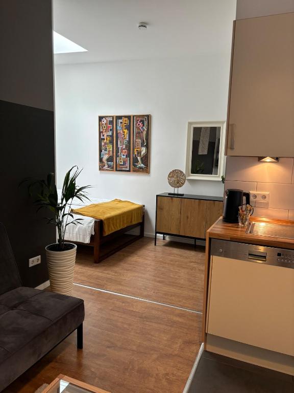 a living room with a couch and a table at Moderne Wohnung Kerpen in Kerpen