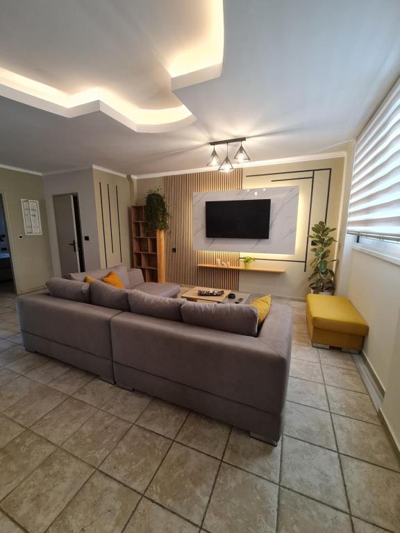 Телевизор и/или развлекательный центр в HYGGELIG apartment