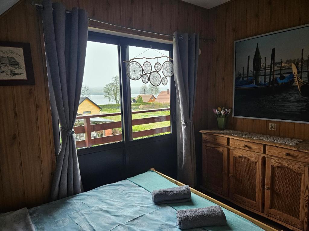 Postel nebo postele na pokoji v ubytování Grabówka