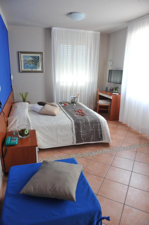 Postel nebo postele na pokoji v ubytování Hotel Bellavista Meublè