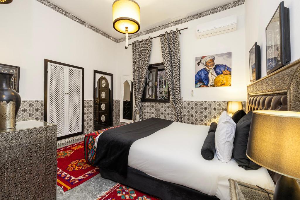 Postel nebo postele na pokoji v ubytování Riad Luzia