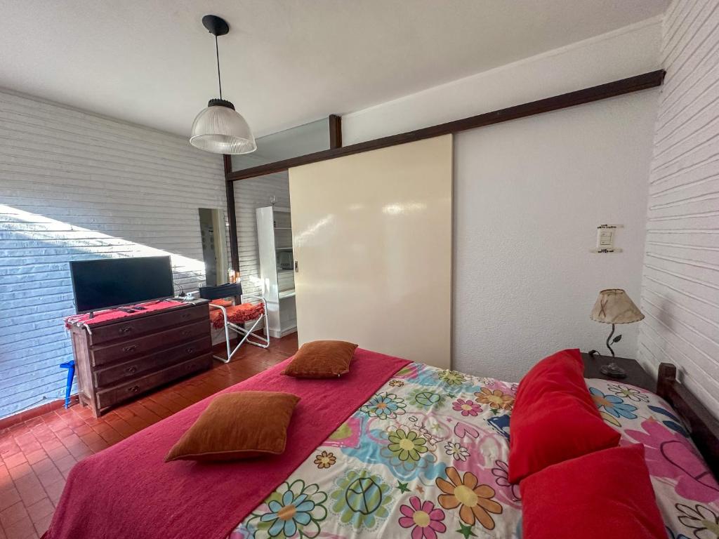 Ένα ή περισσότερα κρεβάτια σε δωμάτιο στο Bungalow en Pinamar