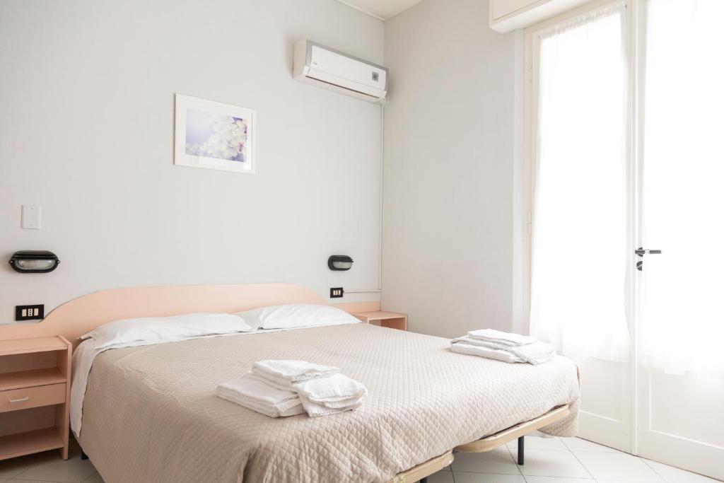Postel nebo postele na pokoji v ubytování Hotel Laura Beach
