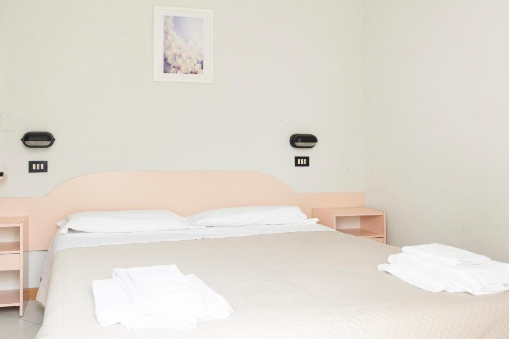 Postel nebo postele na pokoji v ubytování Hotel Laura Beach