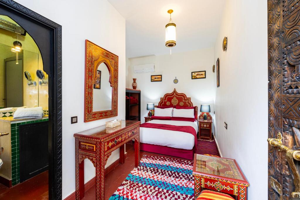 Postel nebo postele na pokoji v ubytování Riad Luzia