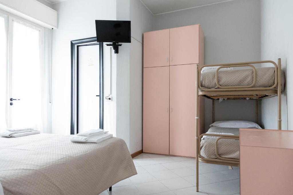 Postel nebo postele na pokoji v ubytování Hotel Laura Beach