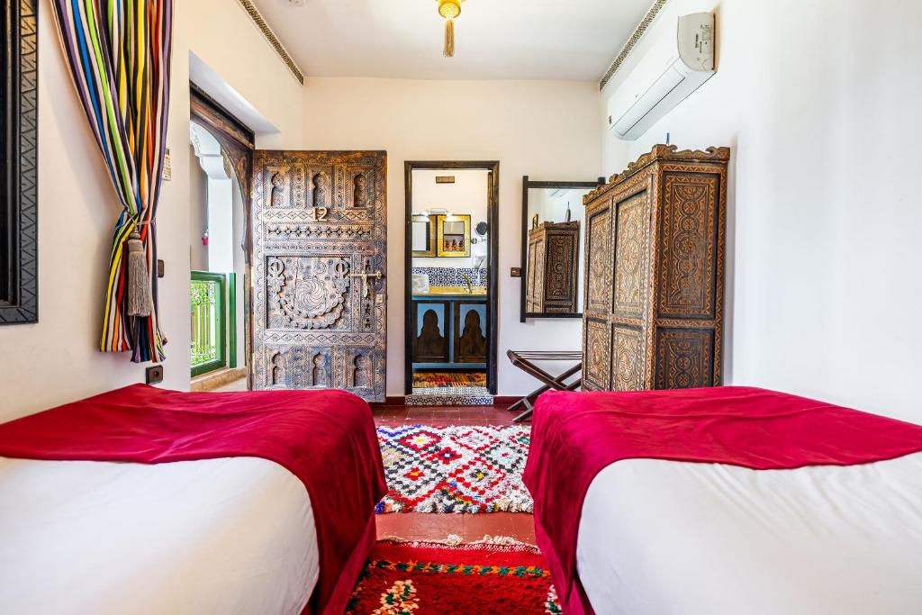 Postel nebo postele na pokoji v ubytování Riad Luzia