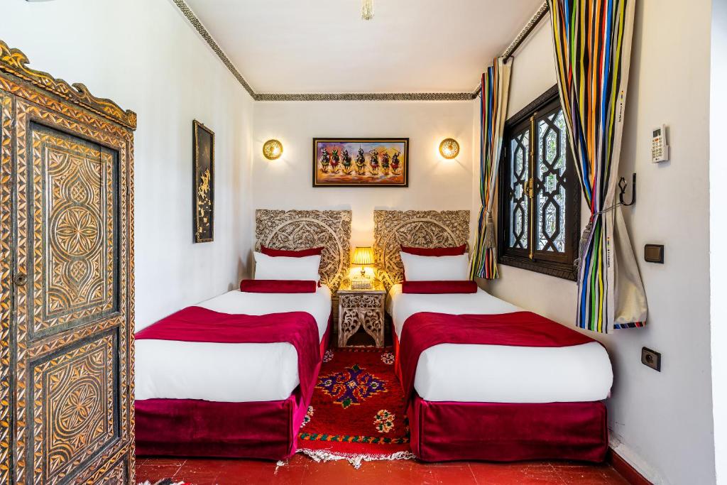 Postel nebo postele na pokoji v ubytování Riad Luzia