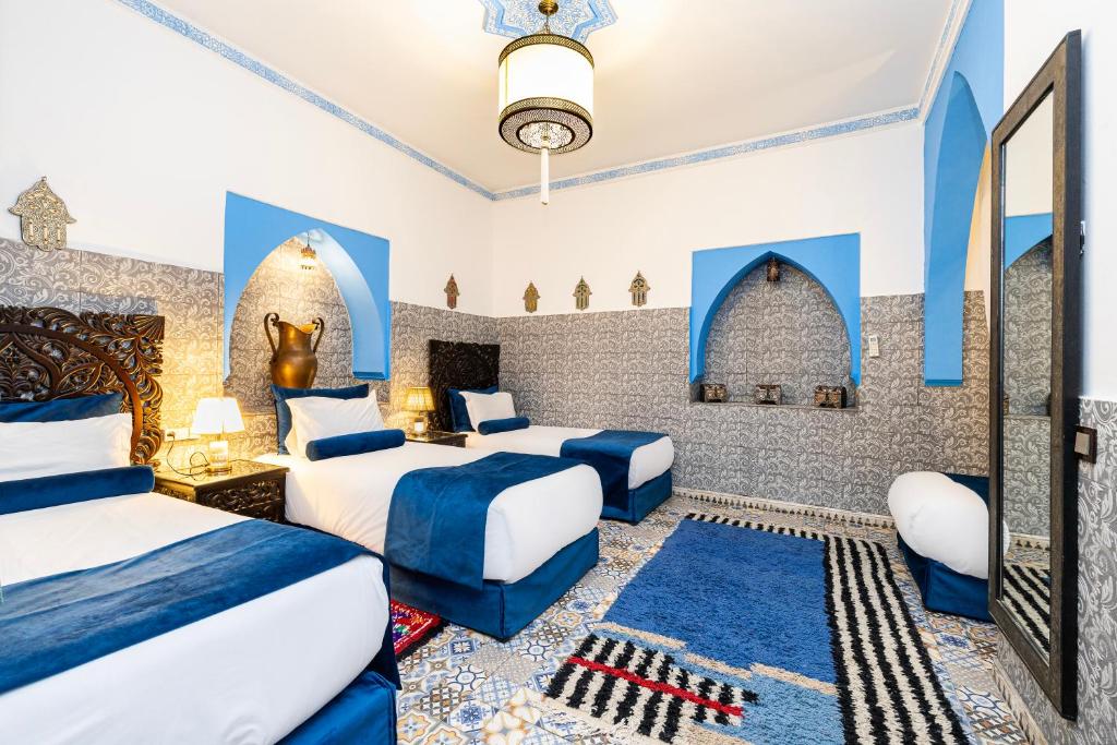 Postel nebo postele na pokoji v ubytování Riad Luzia