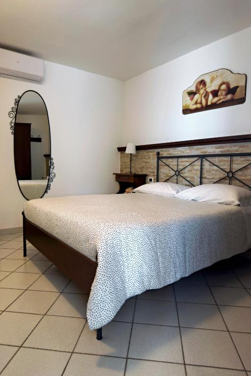 Posteľ alebo postele v izbe v ubytovaní Villa Maria Gaeta