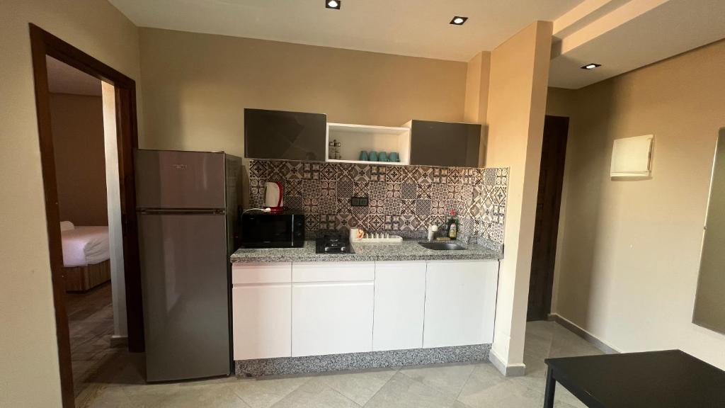 Kuchyň nebo kuchyňský kout v ubytování Appartement 3 vue sur mer