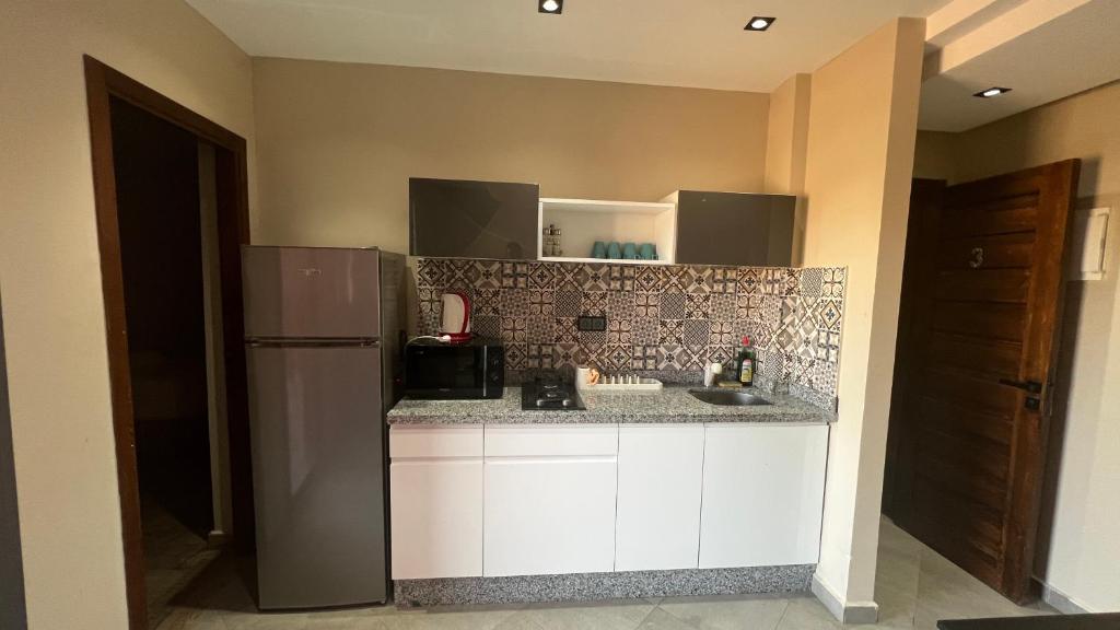 Kuchyň nebo kuchyňský kout v ubytování Appartement 3 vue sur mer