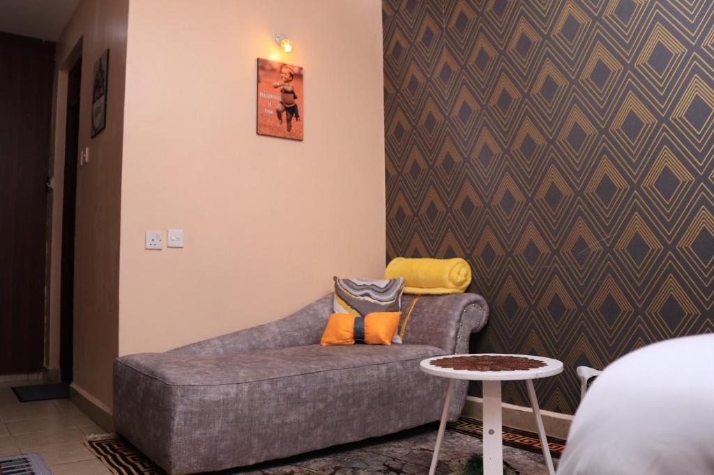 Postel nebo postele na pokoji v ubytování budget bliss ruaka