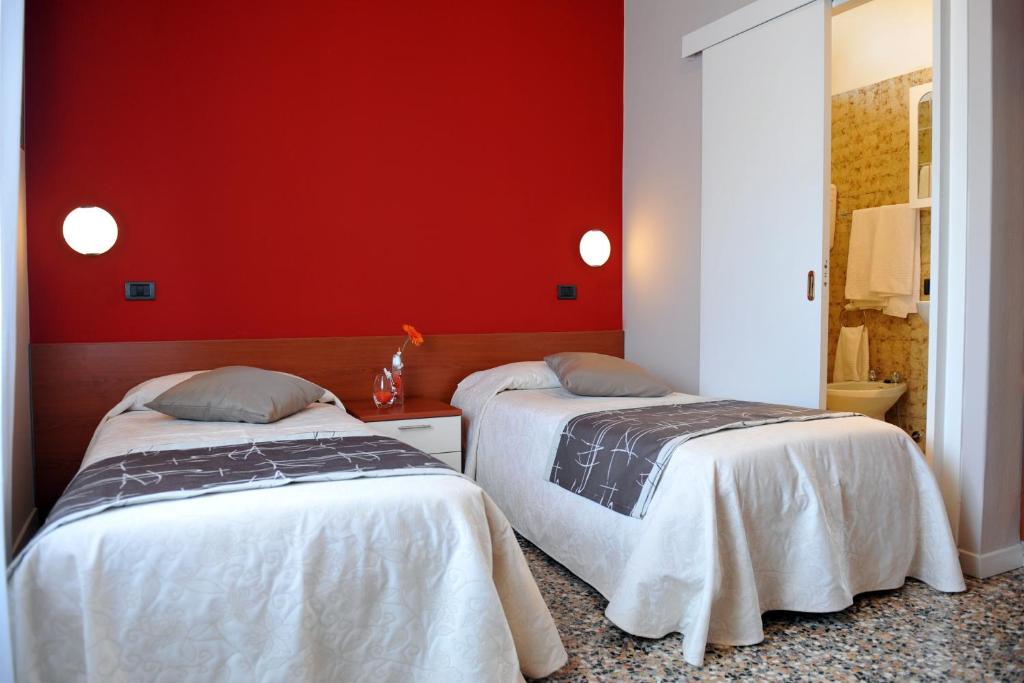 Postel nebo postele na pokoji v ubytování Hotel Bellavista Meublè