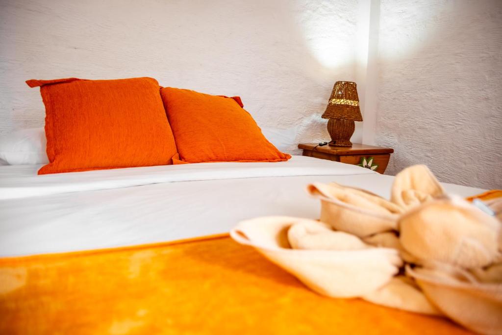 Postel nebo postele na pokoji v ubytování Hotel Miconia