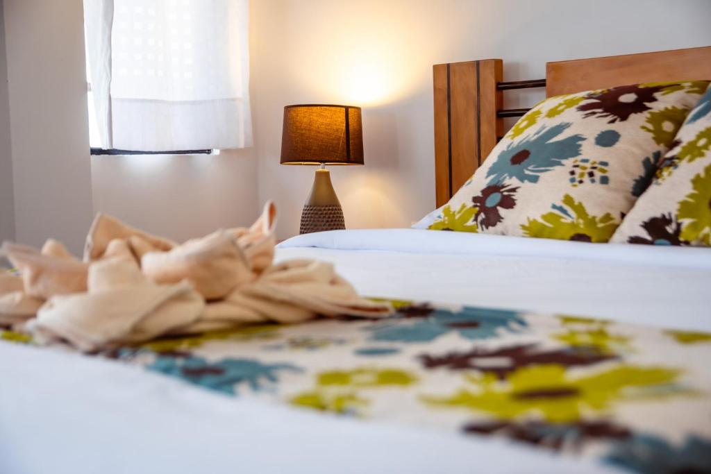 Postel nebo postele na pokoji v ubytování Hotel Miconia