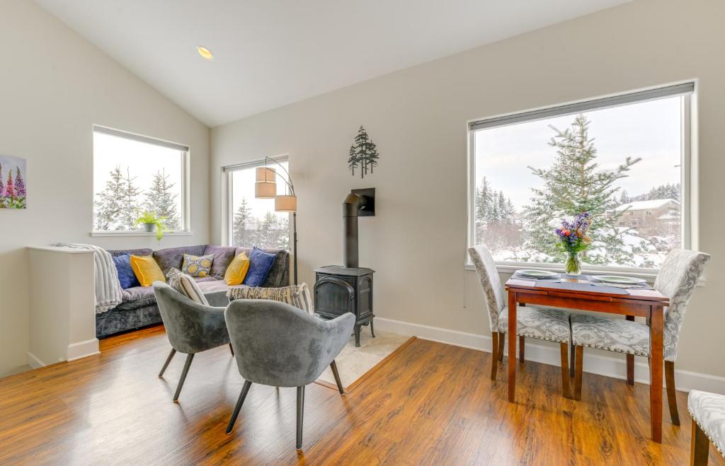 a living room with a table and chairs at Scenic and Cozy Sweet Northern Comfort in Homer! in Homer