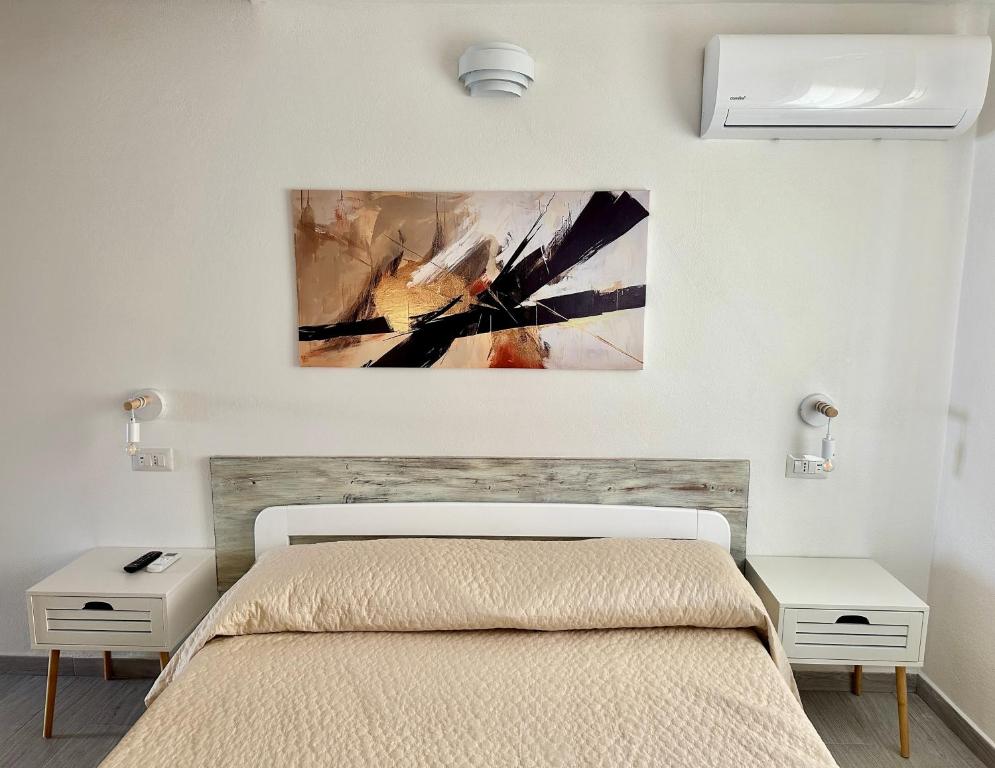 Postel nebo postele na pokoji v ubytování Approdo Apartments
