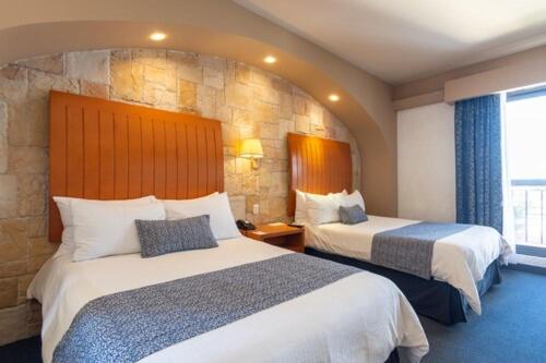 Postel nebo postele na pokoji v ubytování Hotel Flamingo Inn