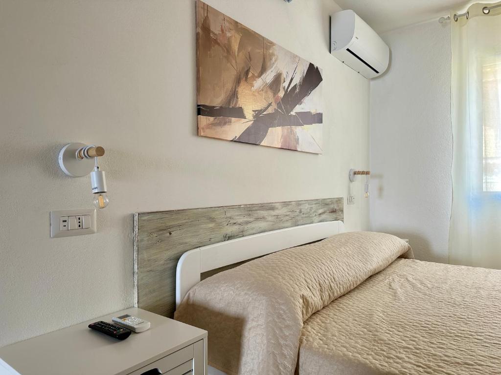 Postel nebo postele na pokoji v ubytování Approdo Apartments