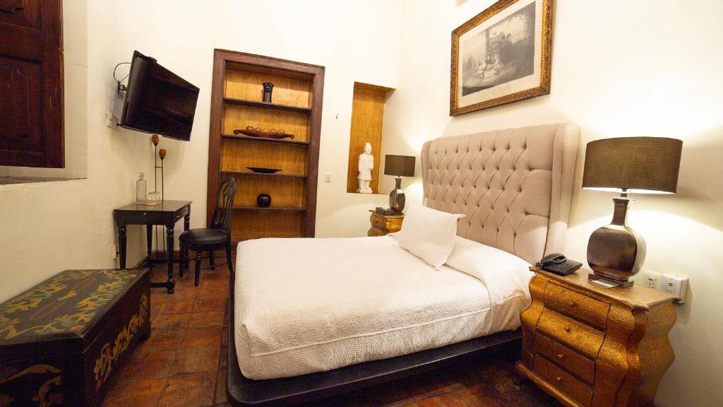 Postel nebo postele na pokoji v ubytování Casa Pedro Loza