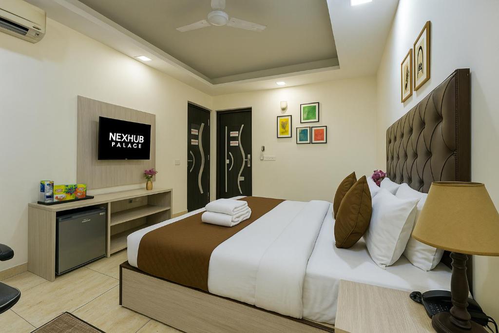 Postel nebo postele na pokoji v ubytování Nexhub Arcadia- Sector 39 Medanta