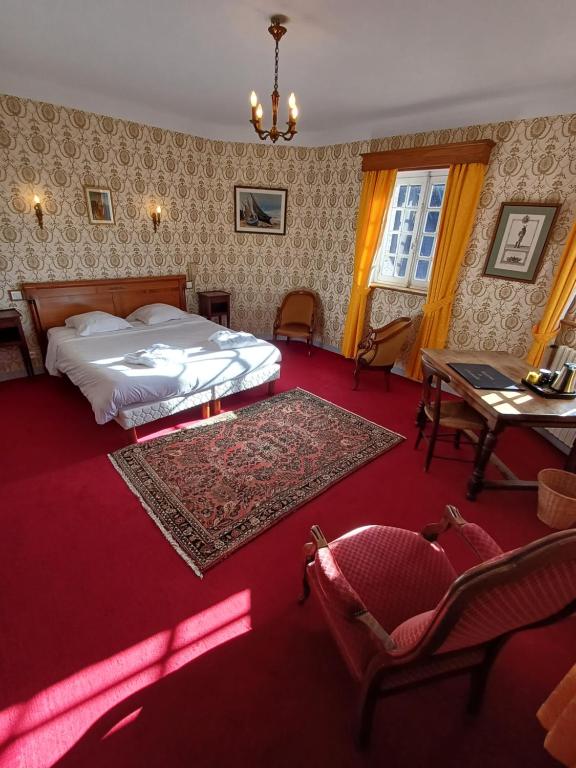 Postel nebo postele na pokoji v ubytování Manoir Du Stang