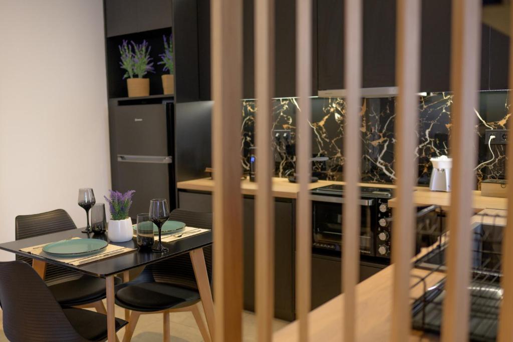 Kuchyň nebo kuchyňský kout v ubytování MELANÓESSA mjt APARTMENTS